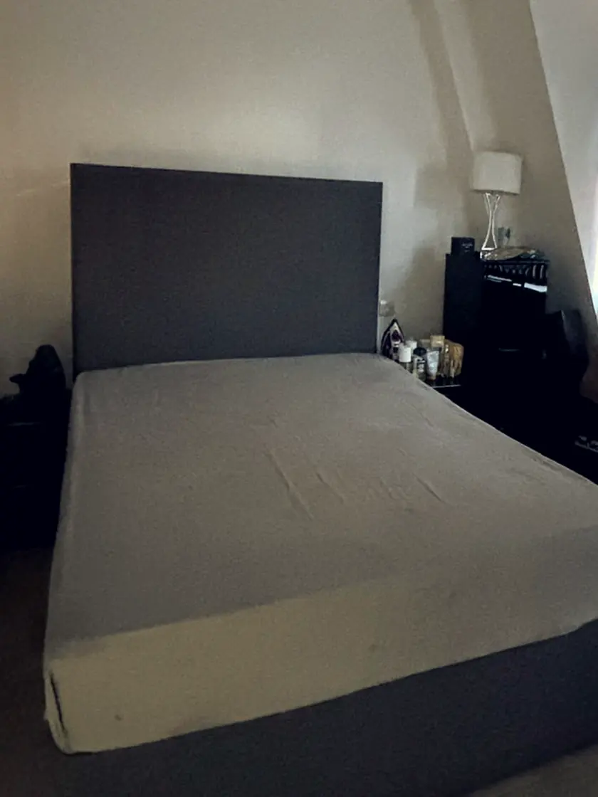 A bedroom stripped back to the mattress, floor and skirting clear.